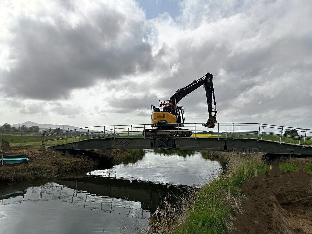 Crane/Digger crossing over bridge